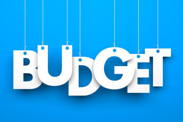 the word budget on a blue background